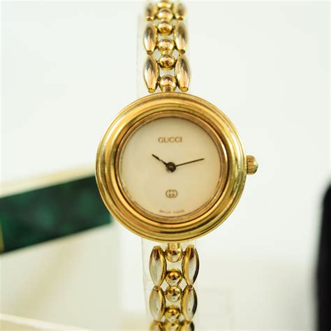 gucci 1100 gold plated bezel watch|Gucci watch with changeable bezels.